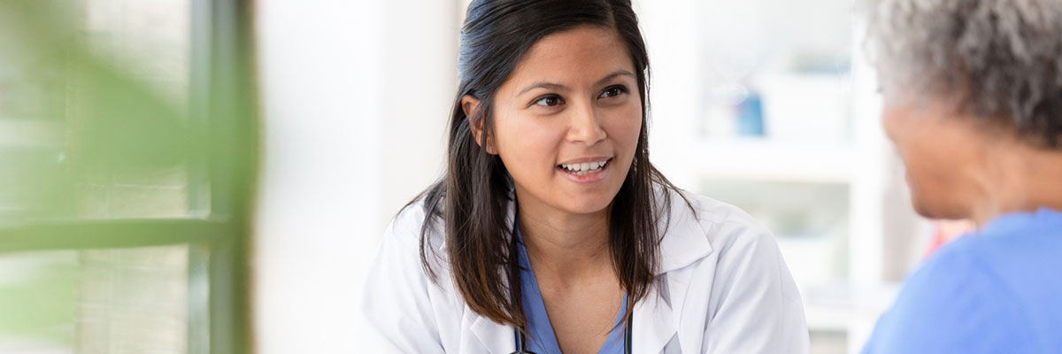 An oncologist discusses uterine cancer treatment with a patient at Baptist Cancer Center.