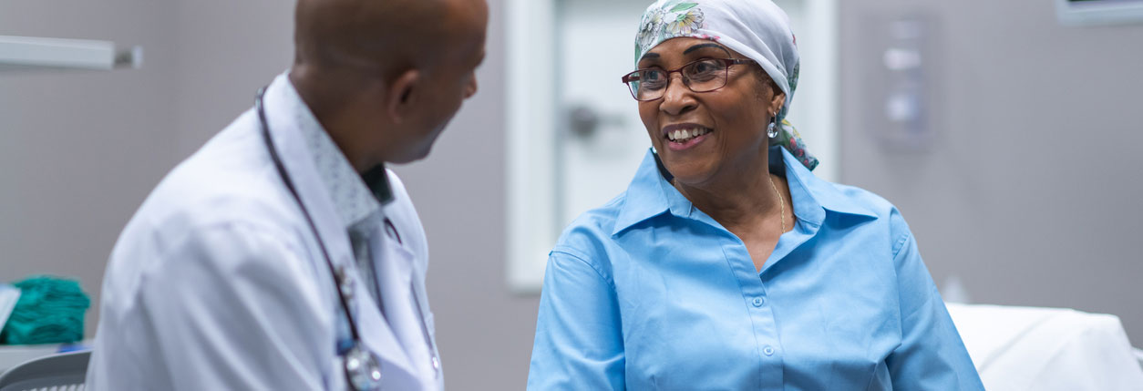 A patient and doctor discuss bladder cancer treatment at Baptist Cancer Center