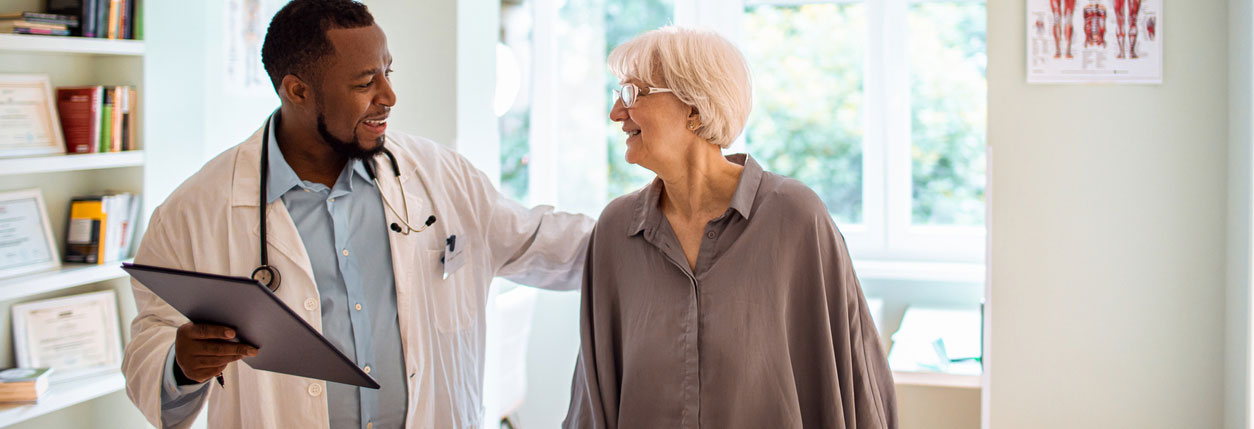A doctor and patient discuss intensity-modulated radiation therapy at Baptist Cancer Center
