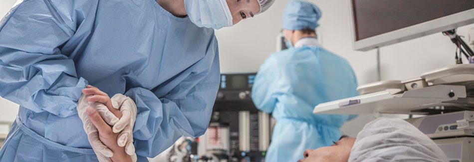 Surgeon consulting with a patient before their da Vinci robotic surgery procedure.