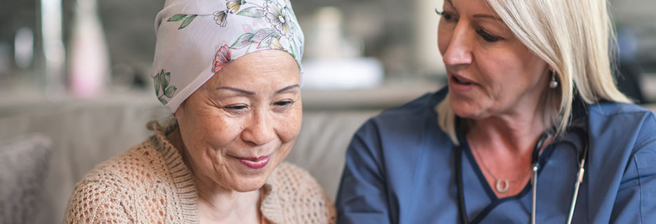 A patient and physician discuss colorectal cancer treatment options at Baptist Cancer Center