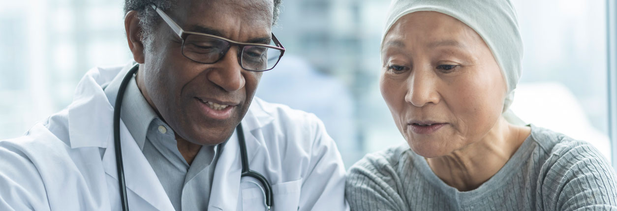 A patient and doctor discuss bone cancer treatment results at Baptist Sarcoma Center
