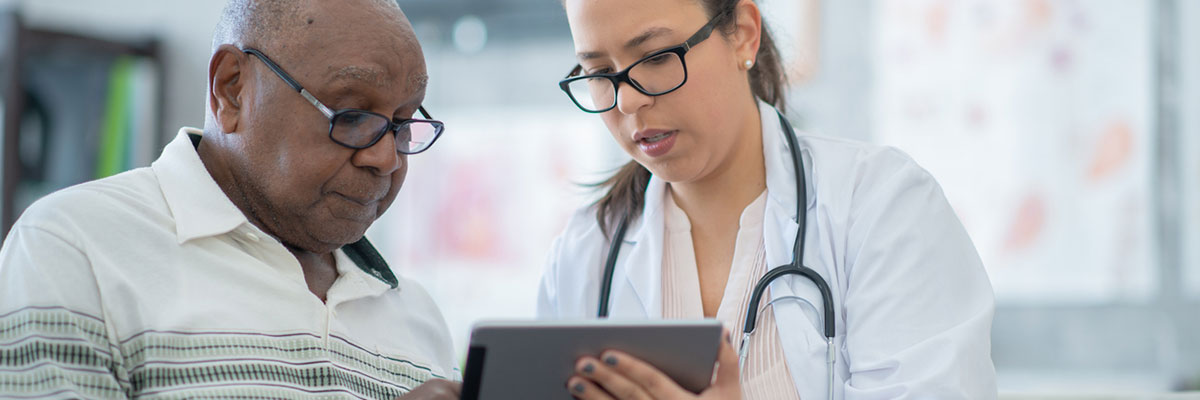 A Baptist Cancer Center doctor delivers personalized, compassionate care and consults with a patient.