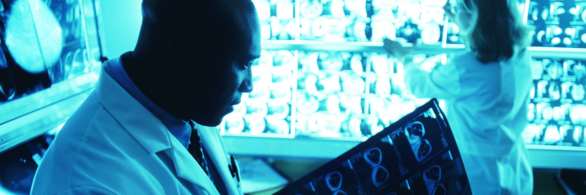 Physician reviewing brain scans